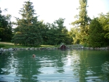Fred (the dog), Abigail and Mark in/near the pond.