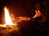 Bill, Abigail and Stephen sitting around the fire.