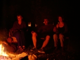 Bill, Moira, Stephen and Tamara sitting around the fire.